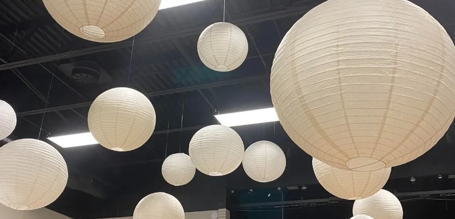 Paper lantern globes hung from the ceiling for an event