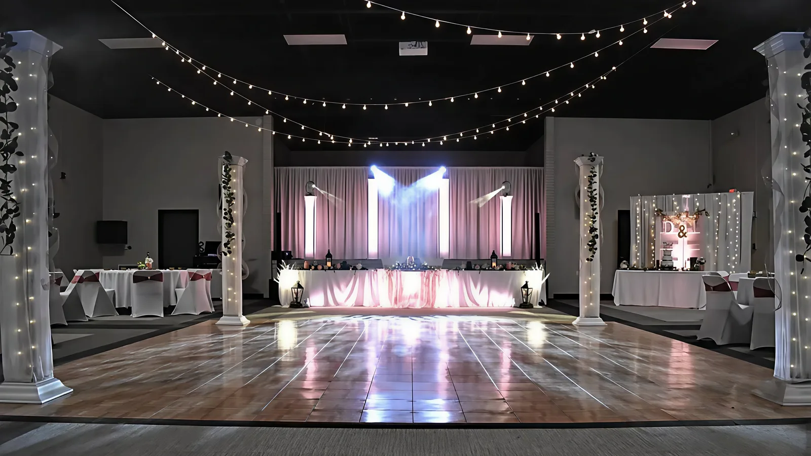 A wedding set up with a draped head table